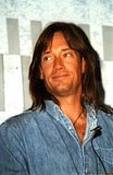 Kevin Sorbo smiling in denim sh...